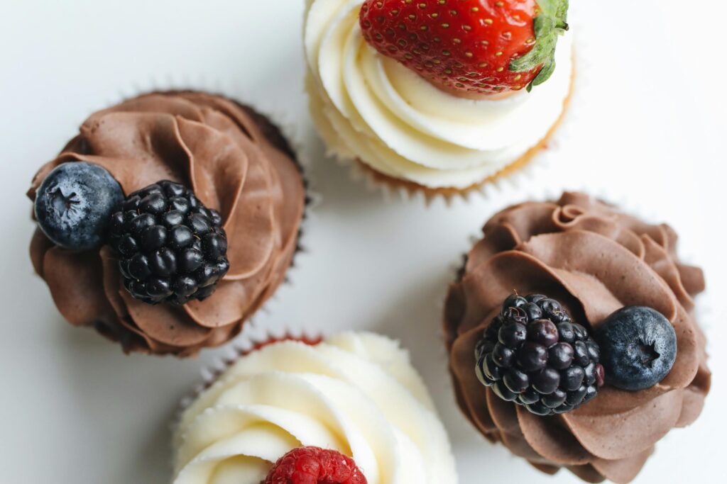 Close-Up Shot of Cupcakes with Berries on Top