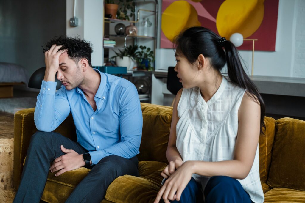 couple on couch talking
