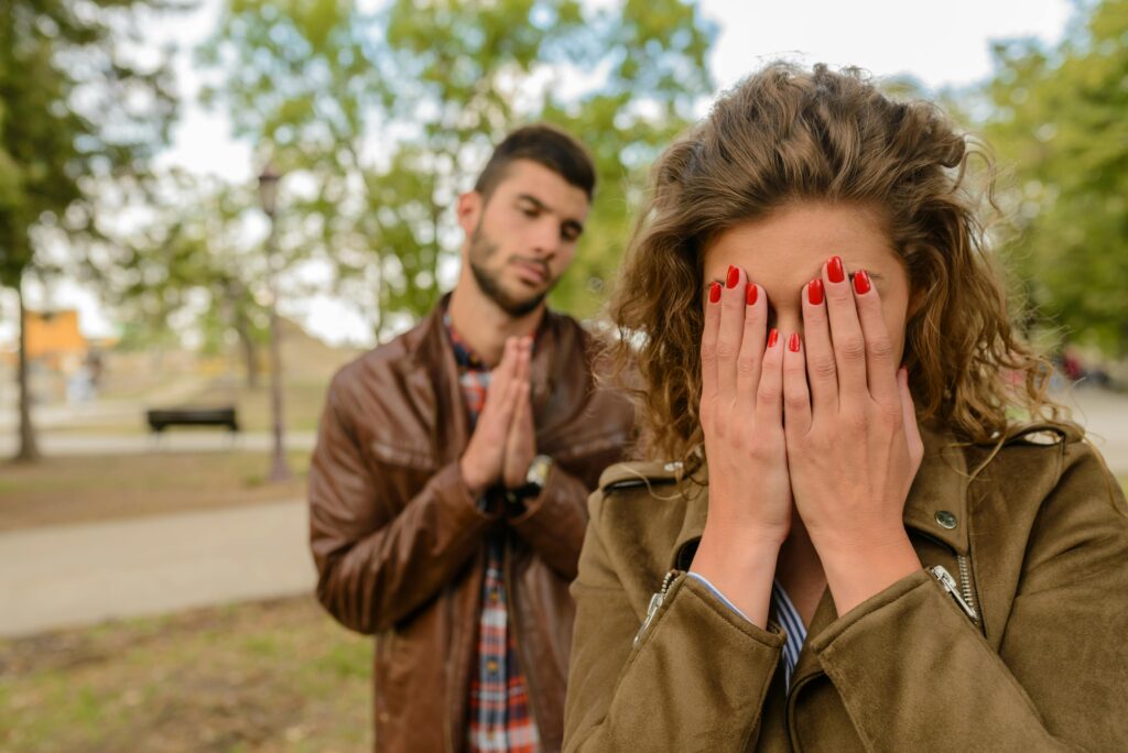 man saying sorry to woman