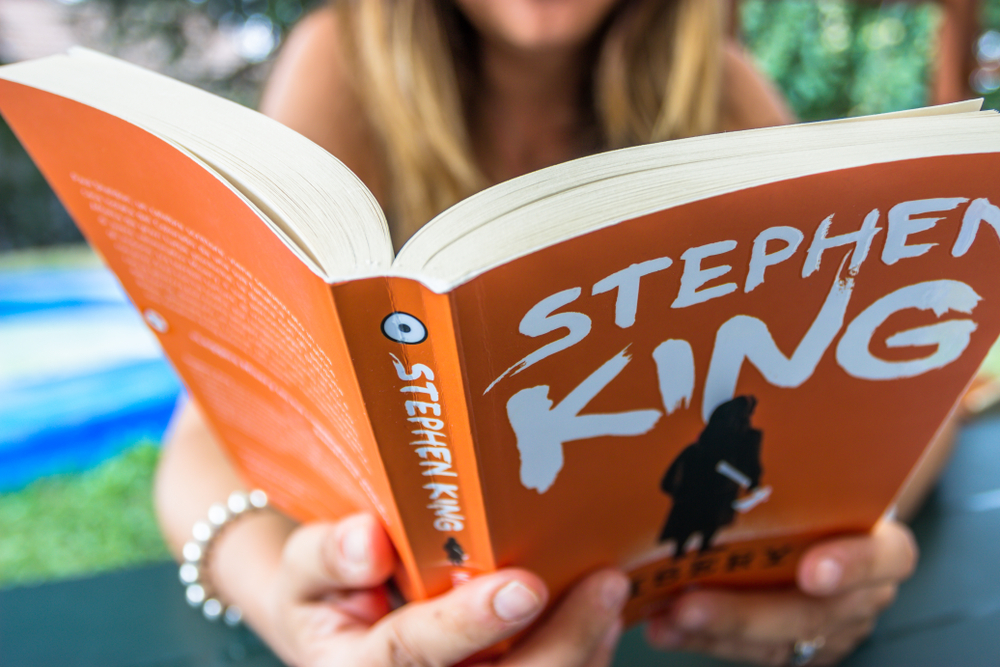 Young Woman Actor Reads Stephen King Misery Book in Sassello,Italy-August 2018