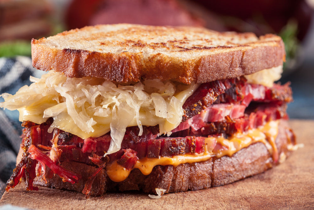 Reuben Sandwich with corned beef, cheese and sauerkraut. Classic New York dish