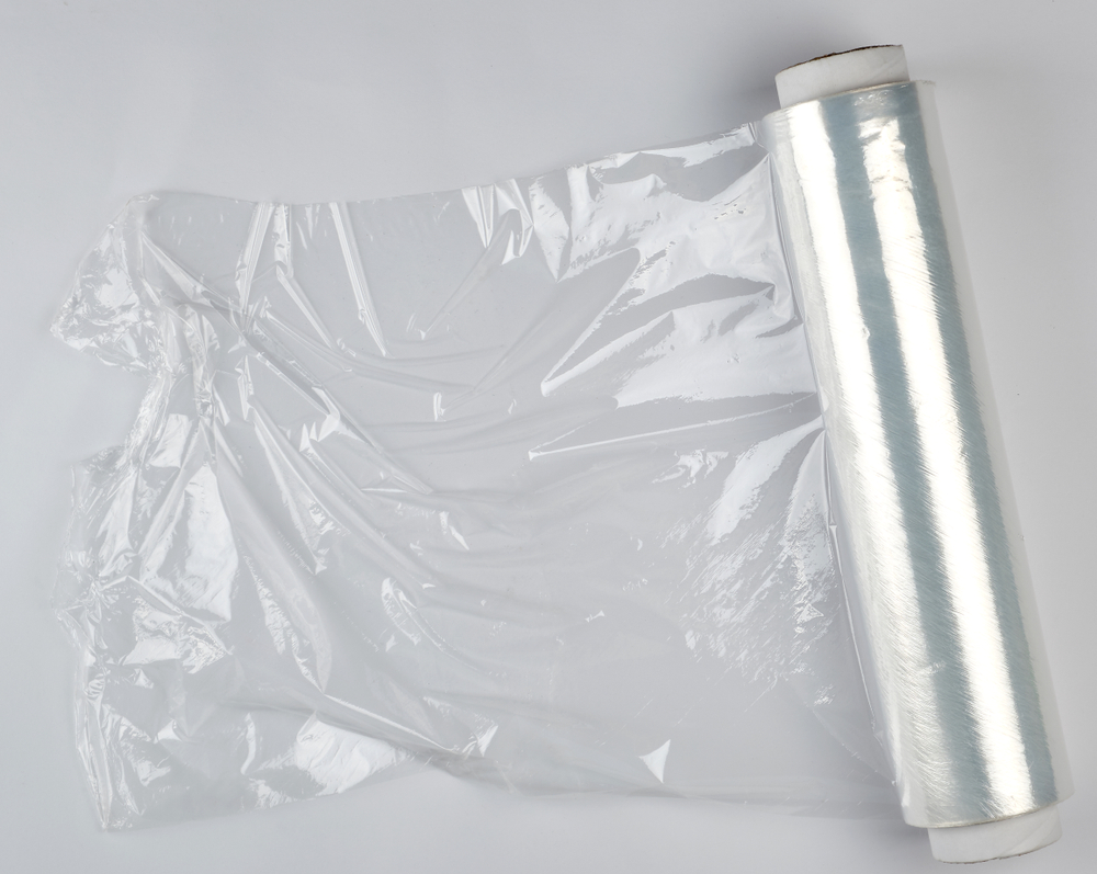 big roll of wound white transparent film for wrapping food, top view