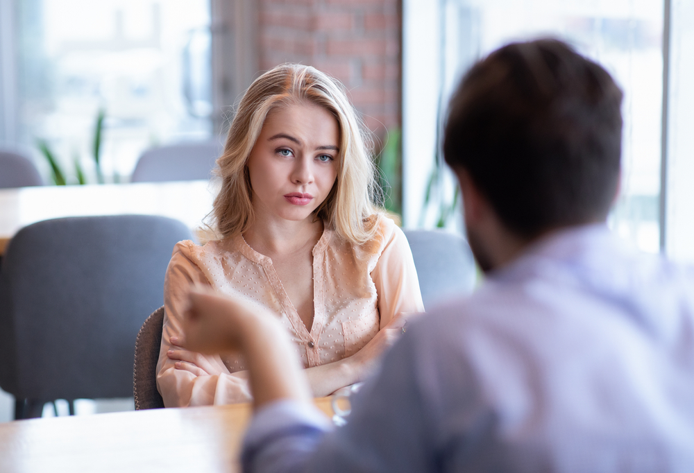 woman looking at man talking