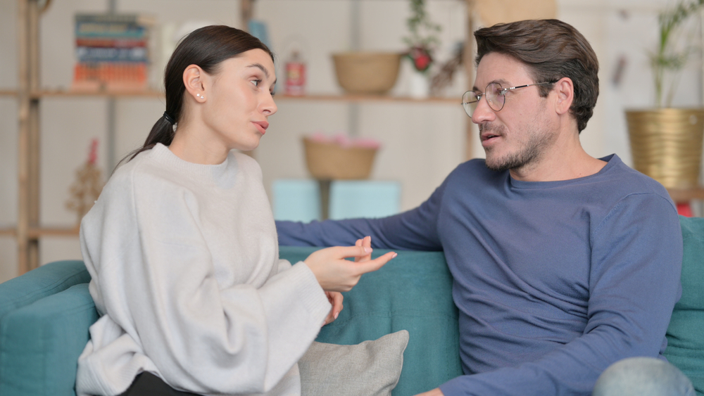 couple talking on couch