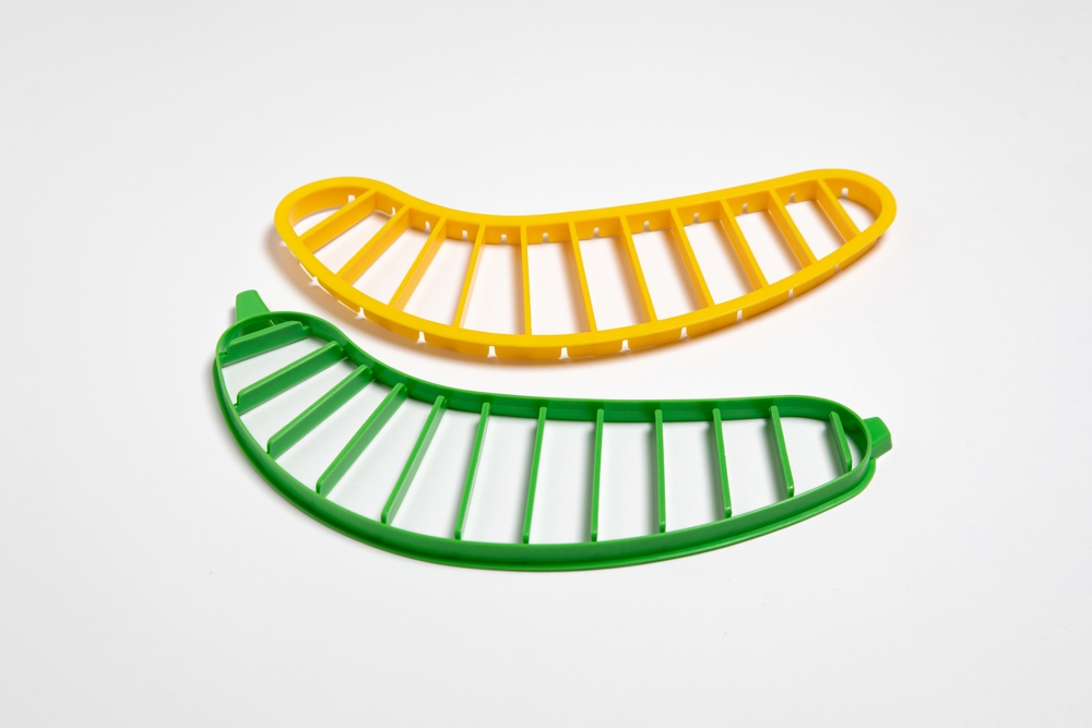 Banana slicer with two cutters isolated on white background.High-resolution photo.Mock up
