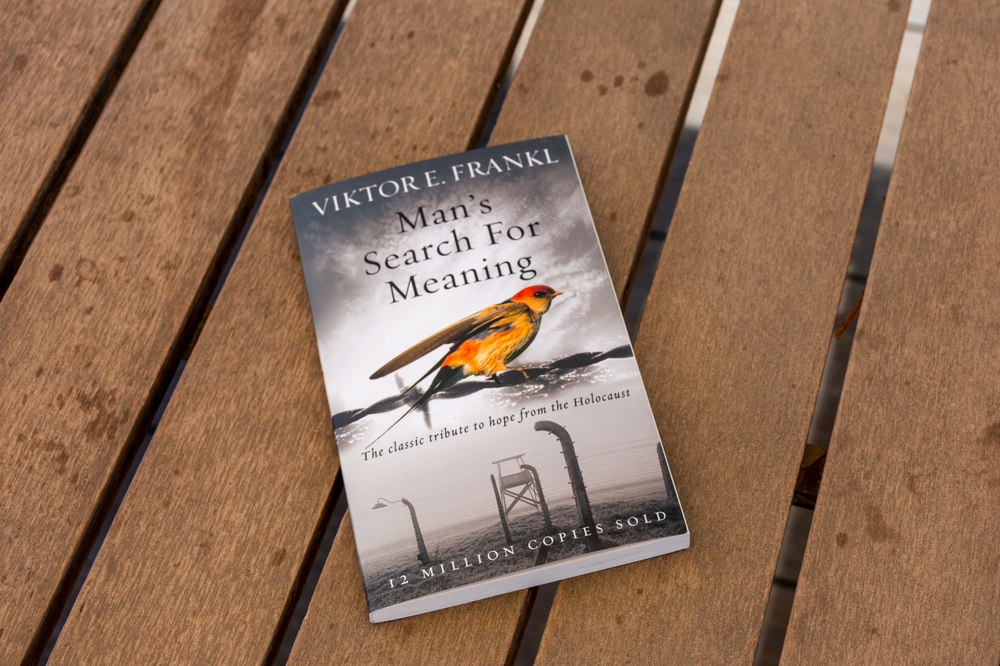 Setif, Algeria - June 9, 2021: Close up Viktor E Frankl's Man's Search For Meaning book on a wooden table.