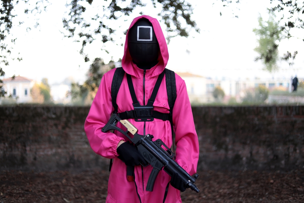 Lucca, Tuscany, Italy - October 29, 2022: Cosplayer dressed as a guard from the Korean TV series Squid Game at the Lucca Comics and Games 2022 cosplay.