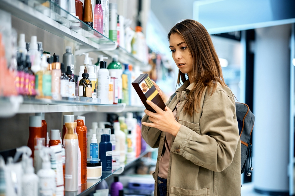woman looking at item on store