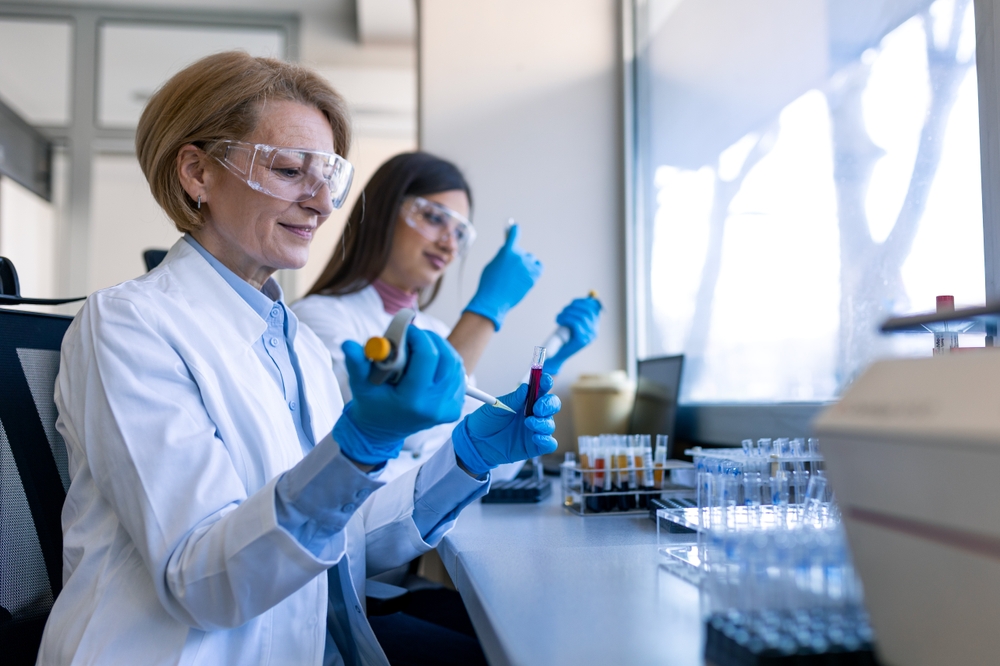 Modern Medical Research Laboratory: Female Scientist Working with Micro Pipette, Analysing Biochemicals Samples. Advanced Scientific Lab for Medicine, Microbiology Development.