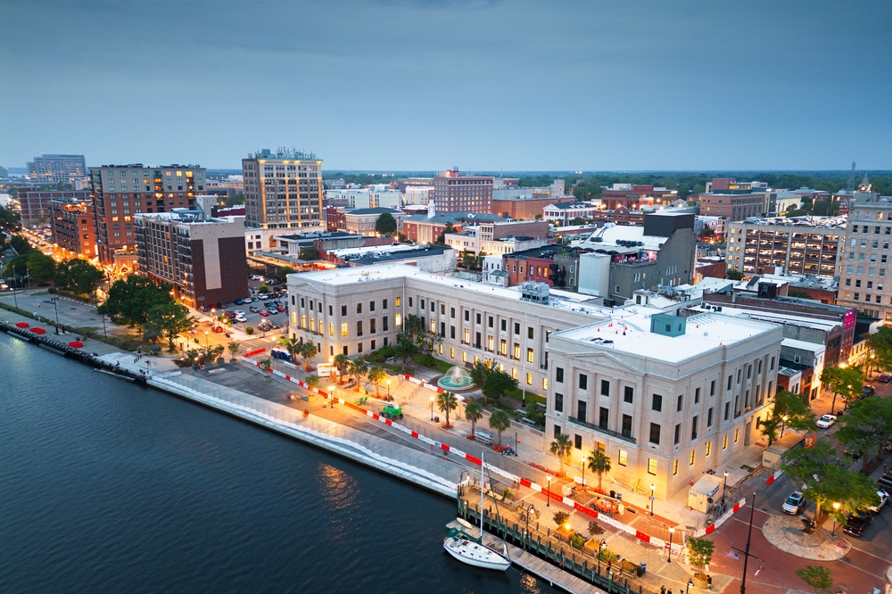 Wilmington, North Carolina, USA aerial cityscape at dusk.