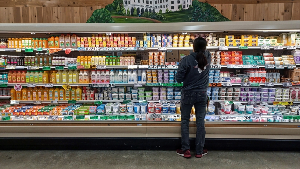 Los Angeles - August 4, 2022: Trader Joe's market dairy aisle being restocked