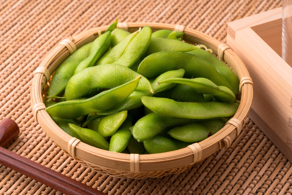 An image of edamame and sake.