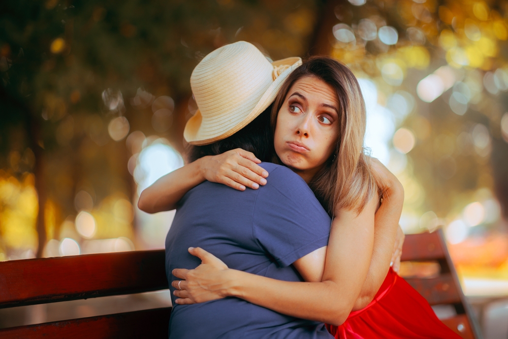 Mother and Daughter Hugging in the park in Reconciliation. Relatives trying to make amends keeping appearances in their relationship