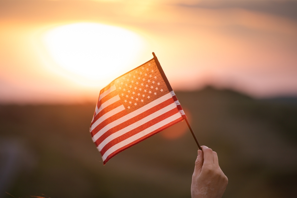 hand waving american flag