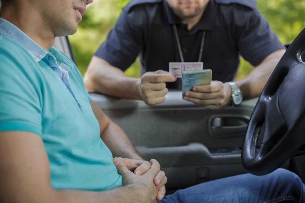 Young male driver stopped for policeman's control