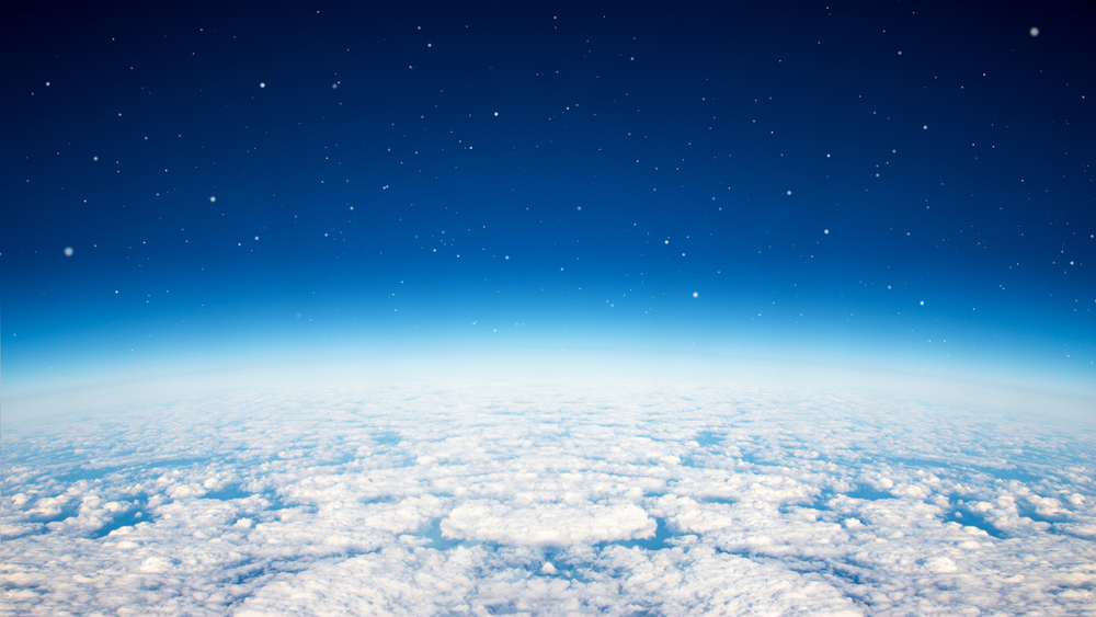 Blue planet earth over the cloudy and star in the sky