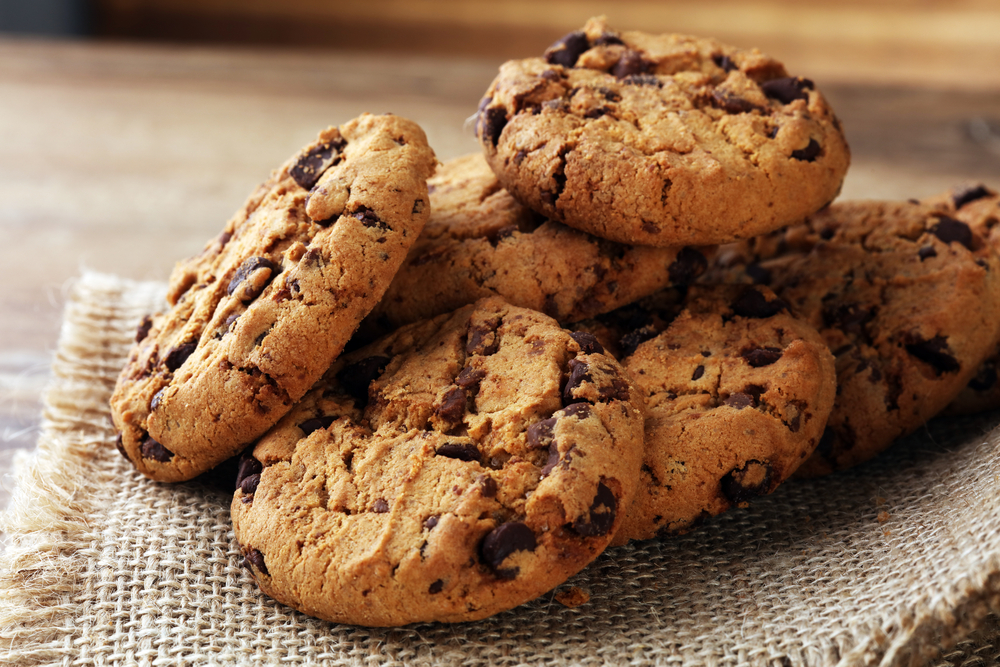 Chocolate cookies on wooden table.