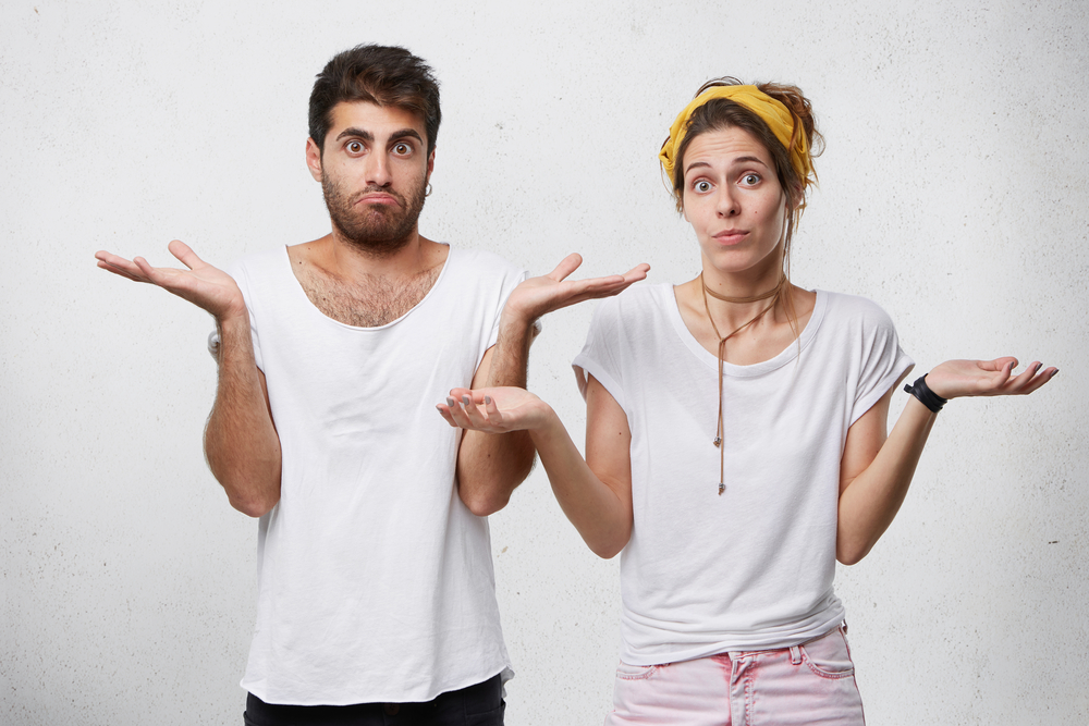 couple arms raised in an expression during conversation