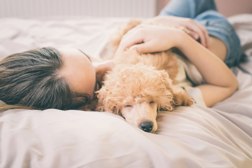 woman holding dog