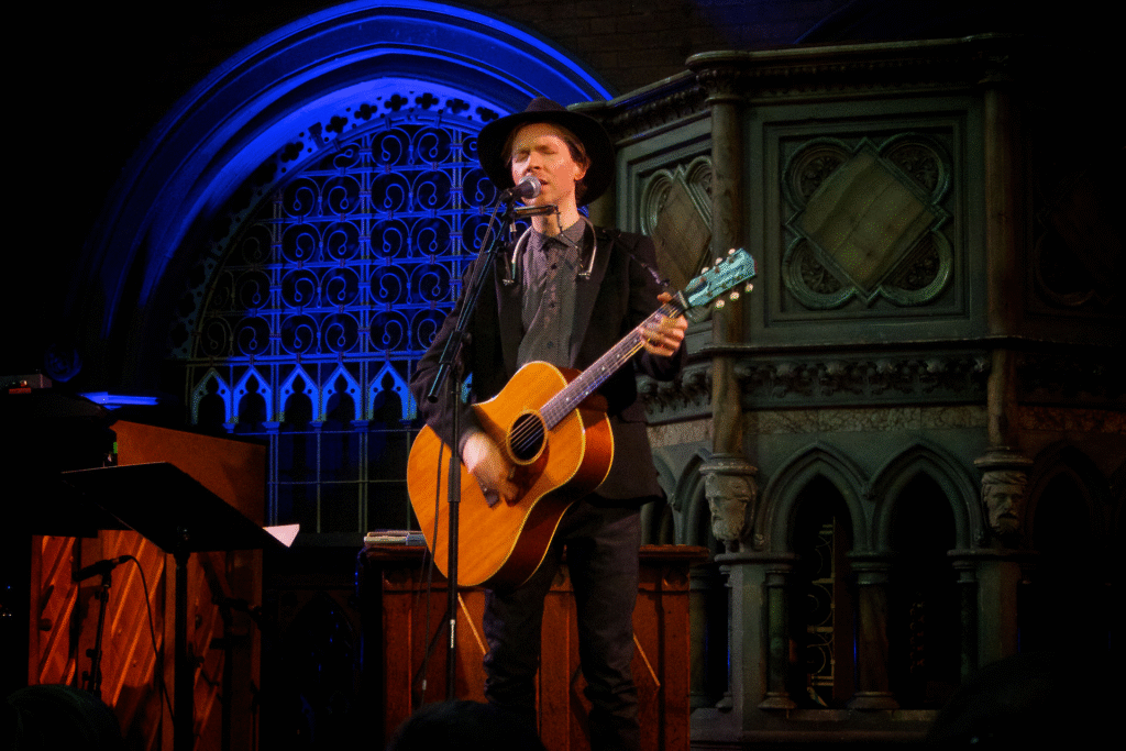 Beck singing on stage