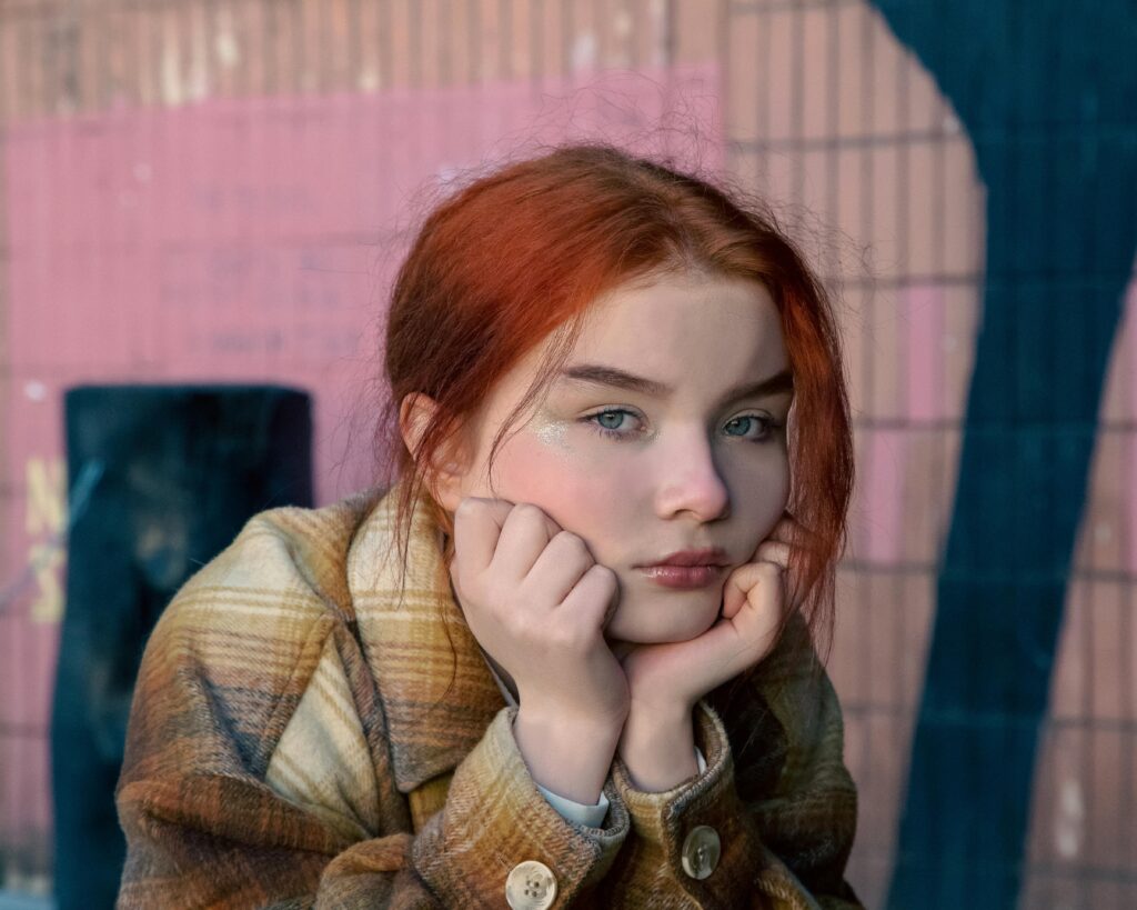 red haired woman with glitter