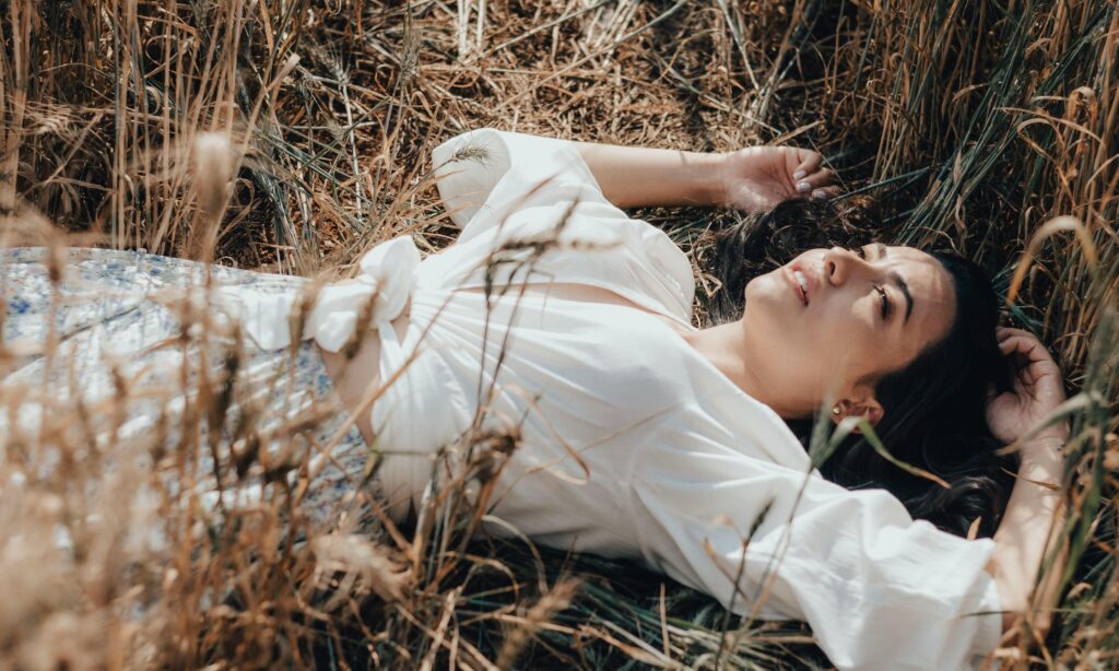 woman lying in field