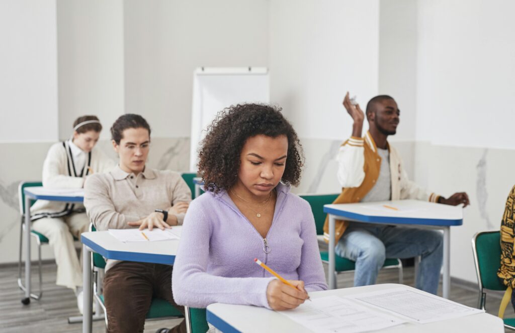 girl with purple top at desk