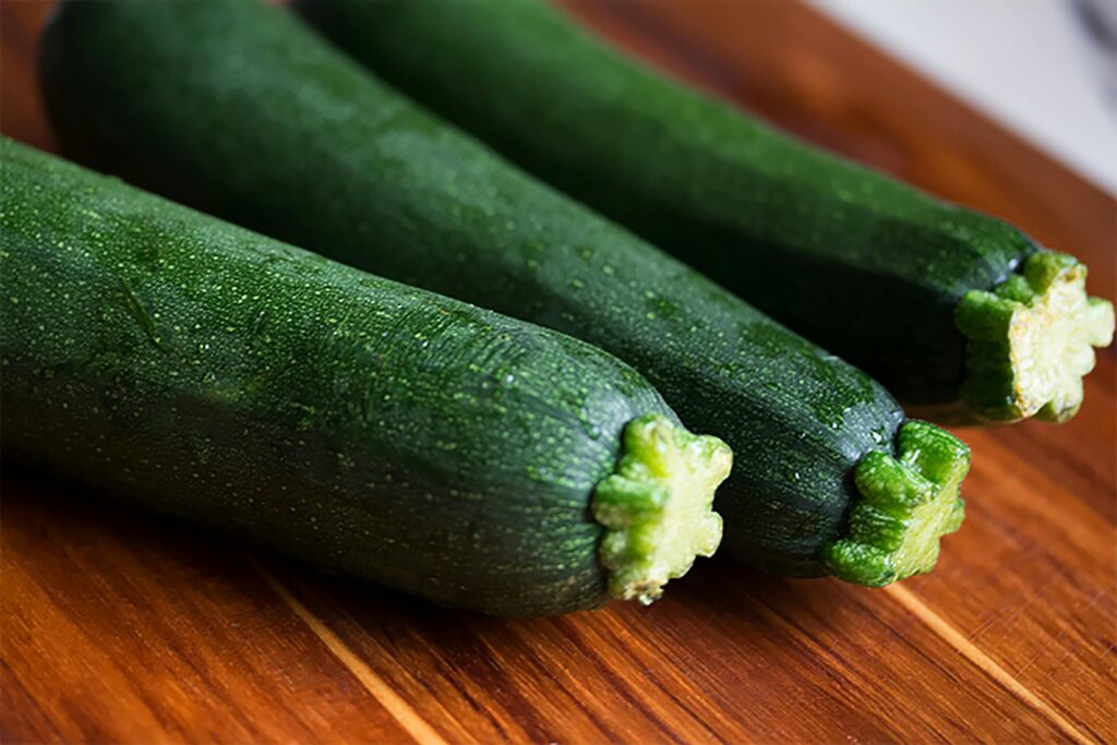 3 zucchinis on a table