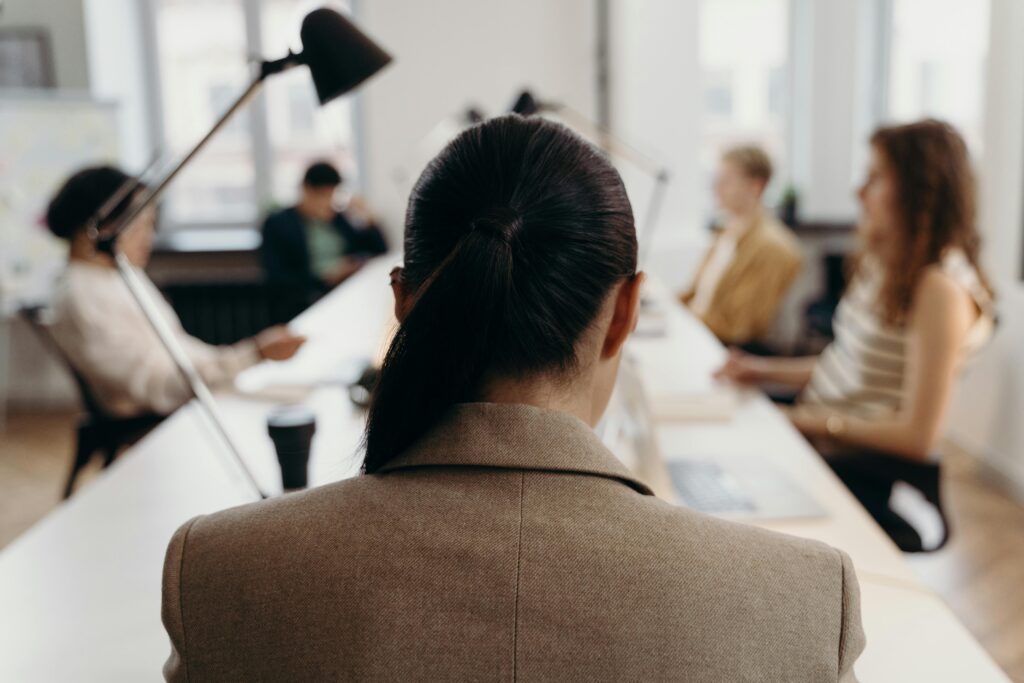 corporate woman sitting at table