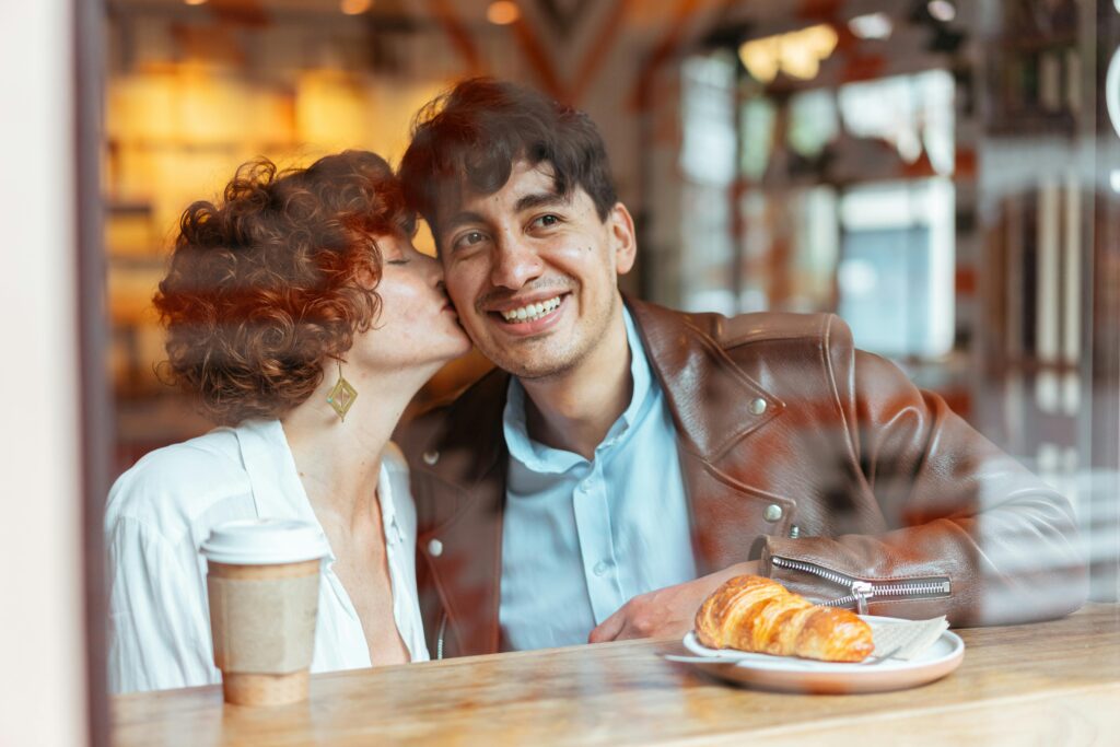 man and woman seen through window