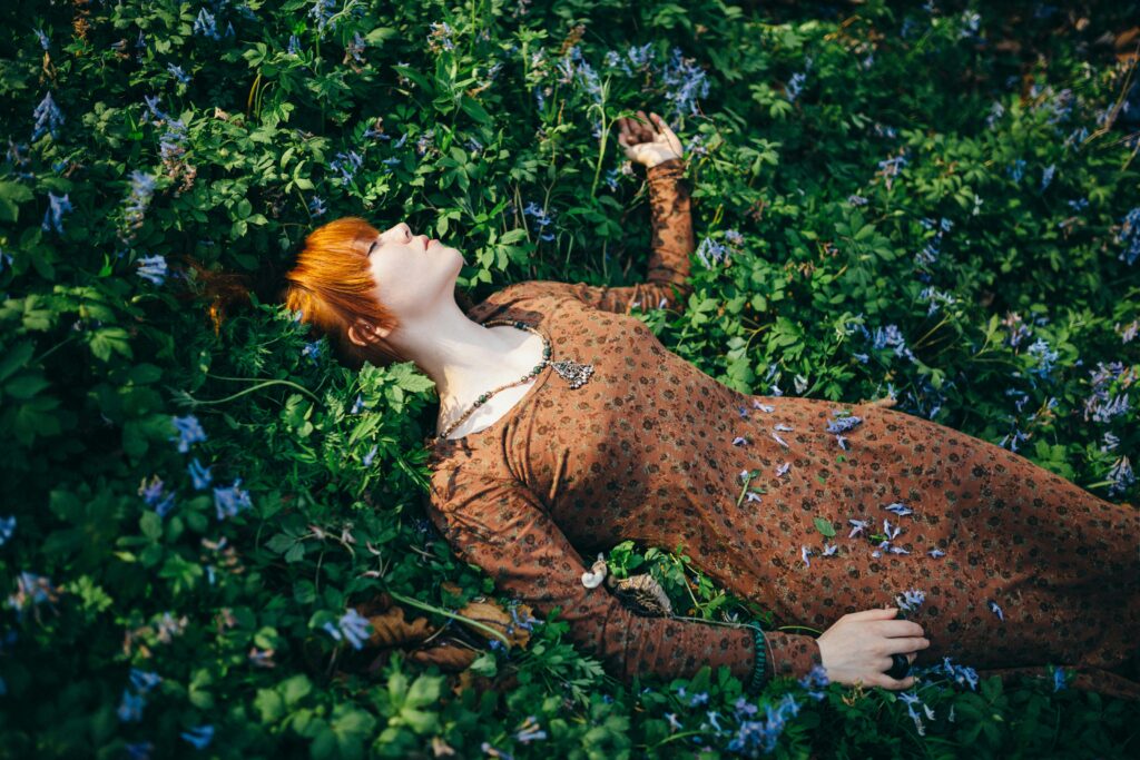 woman lying on grass