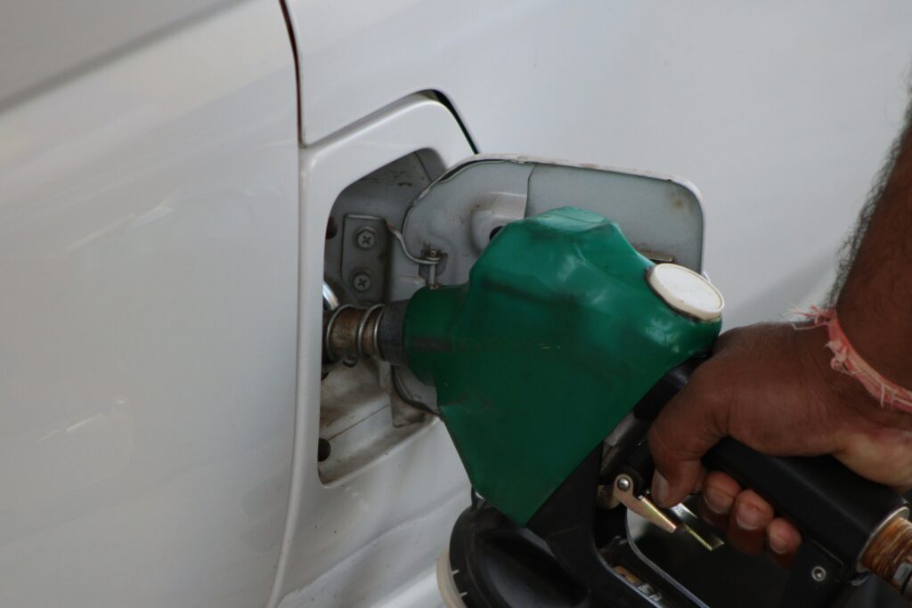 man filling his car with gas