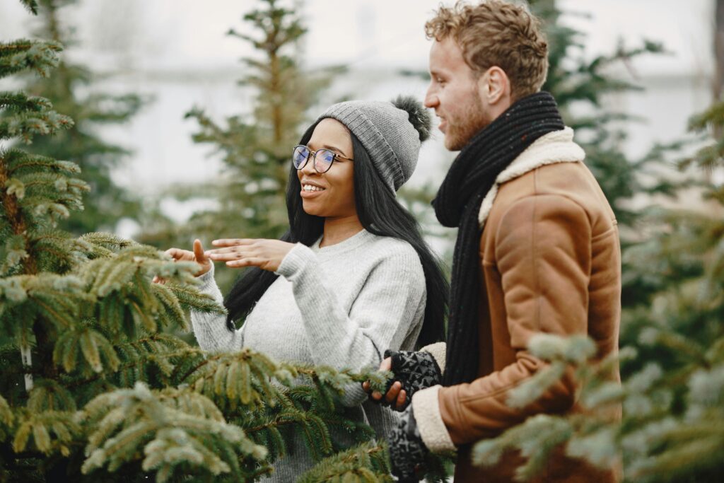 couple shopping for trees