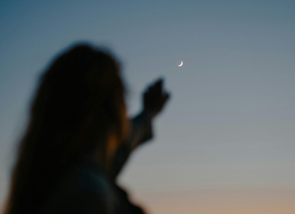 woman reaching to the sky