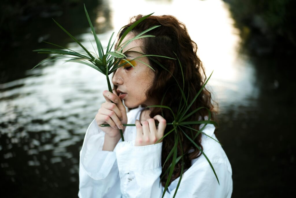 woman holding plants