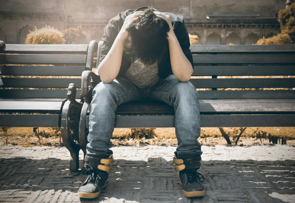 sad man on bench