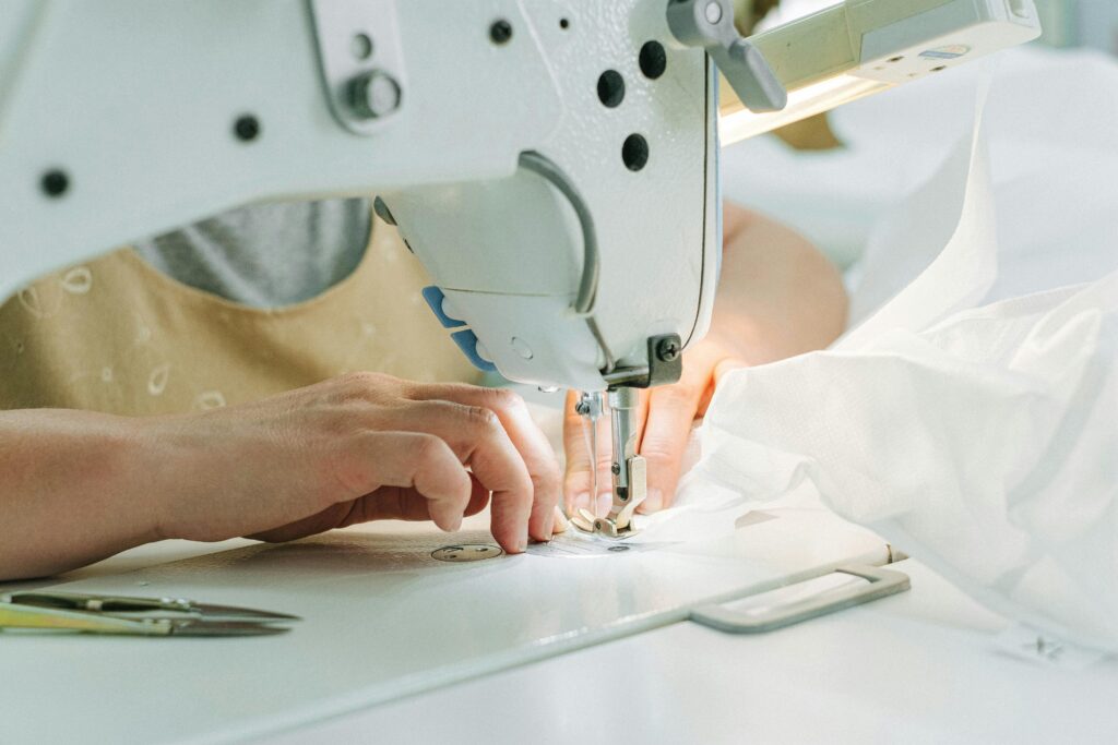 woman sewing a garment