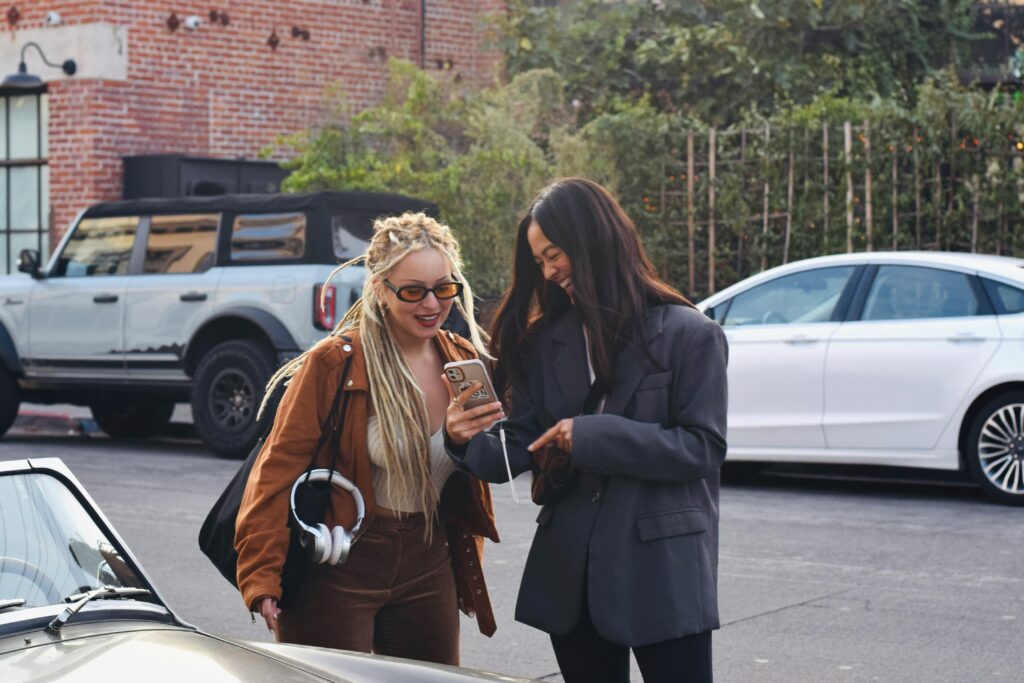 two friends looking at phone