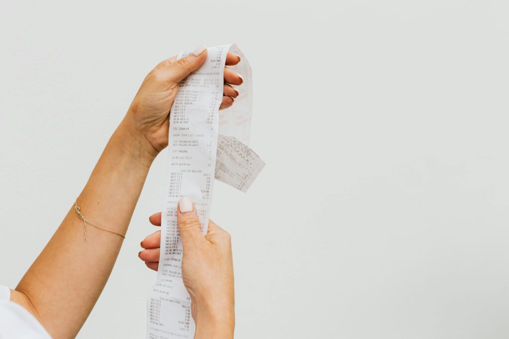 woman holding a paper receipt