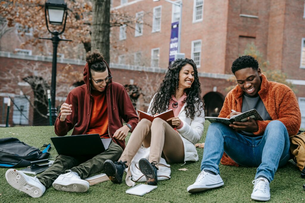 college students stitting on lawn