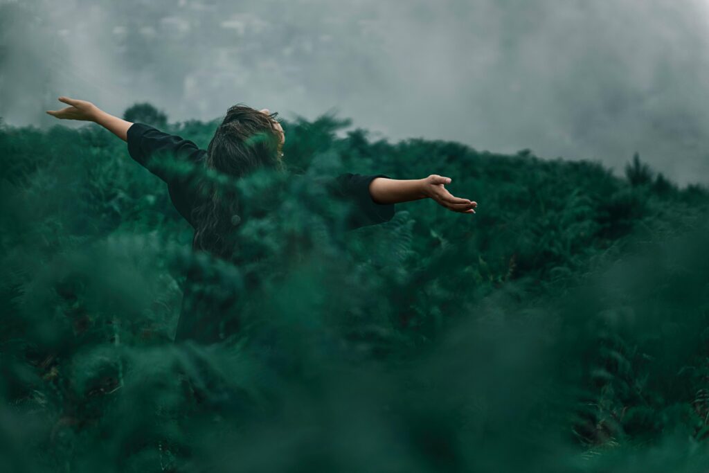 woman in field of ferns