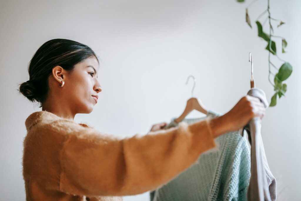 young woman looking at clothing