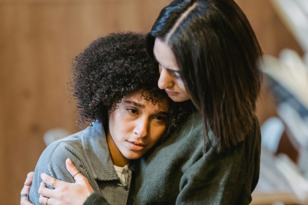 woman consoling another