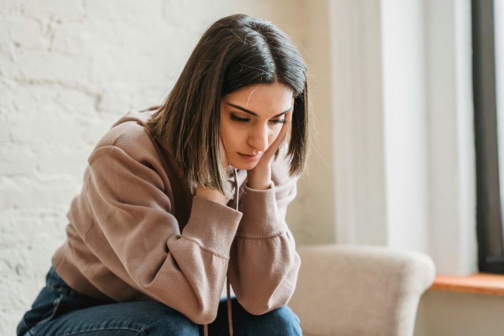 woman looking down at floor