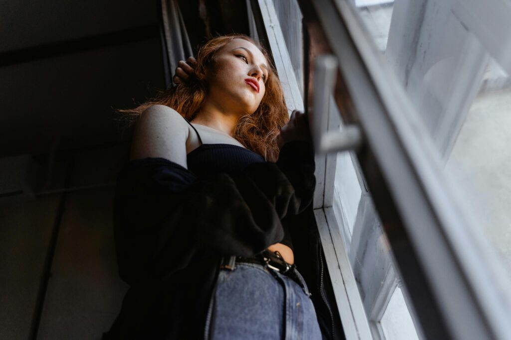 woman staring out the window