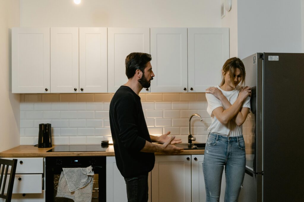woman and man fighting in kitchen