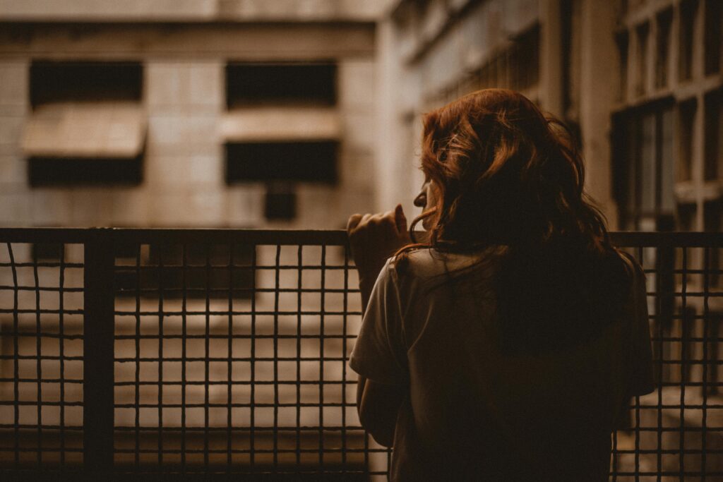 woman holding on railings
