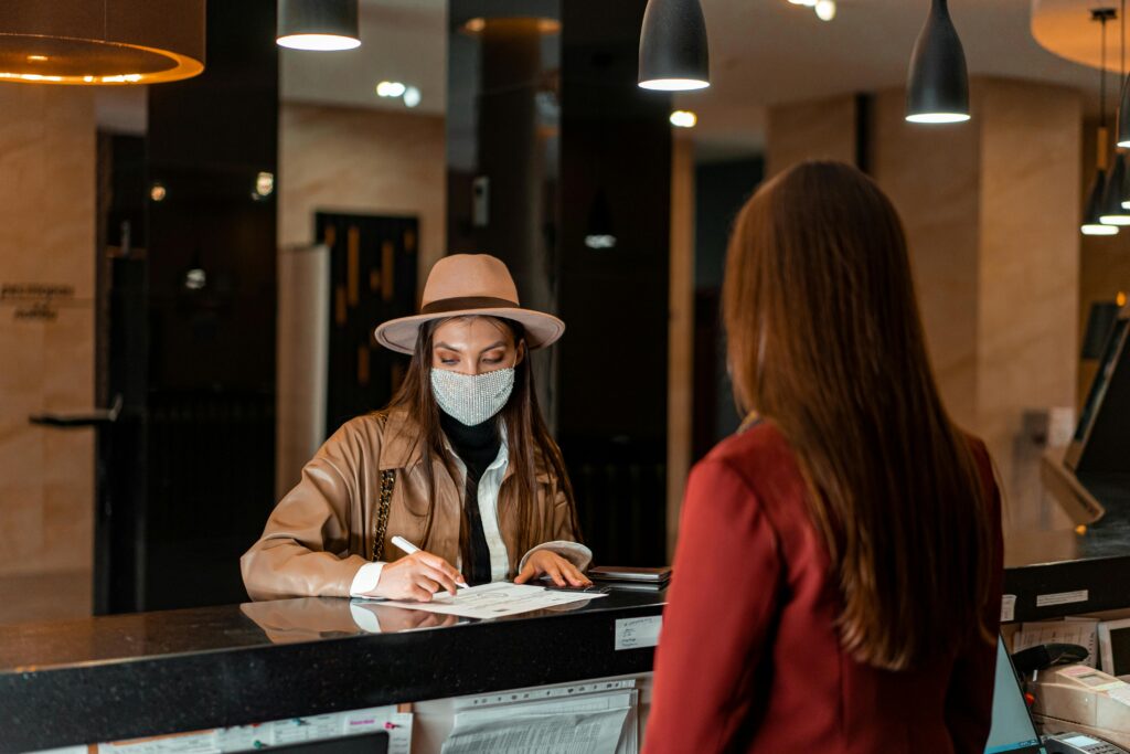 woman at hotel reception desk