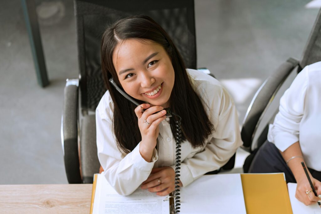 woman at desk on the phone