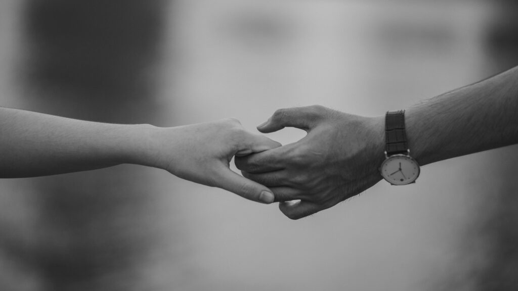 two people holding hands